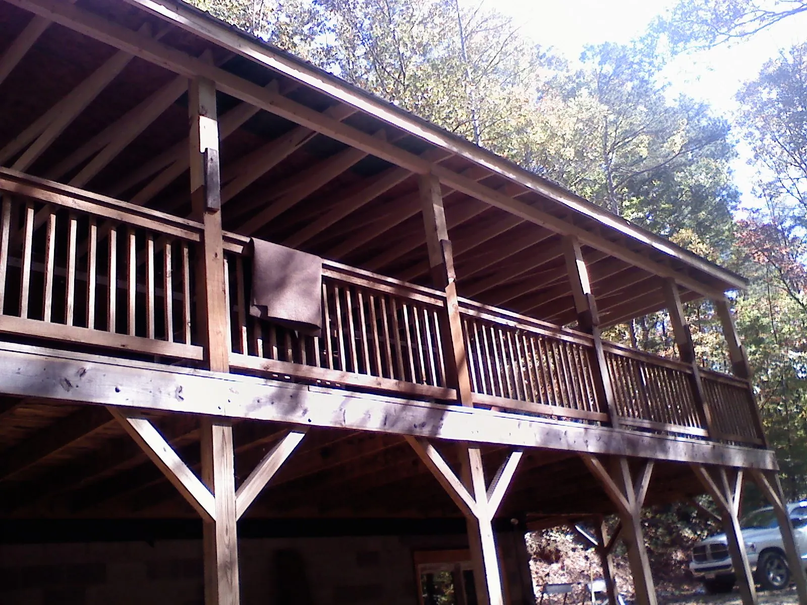 Timber framing under a new elevated porch and deck — Roof Leak Repair in South Pomfret by Roofing Brothers